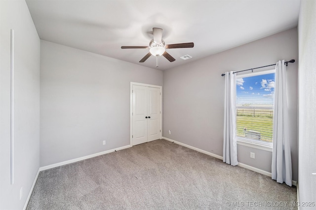 6107 E 127th St N, Collinsville, OK 74021 - carpeted spare room featuring ceiling fan and baseboards