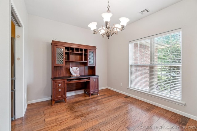 1701 N Skinner Ave, Drumright, OK 74030 - office space featuring a chandelier and light wood-style flooring