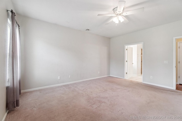 1701 N Skinner Ave, Drumright, OK 74030 - unfurnished bedroom with carpet, ensuite bathroom, and ceiling fan