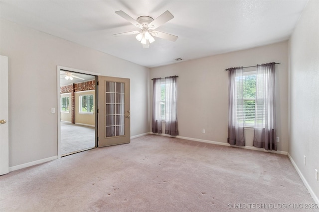 1701 N Skinner Ave, Drumright, OK 74030 - carpeted spare room with plenty of natural light and a ceiling fan