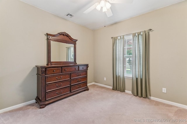 1701 N Skinner Ave, Drumright, OK 74030 - bedroom with light carpet and a ceiling fan