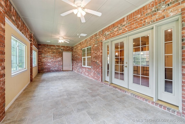 1701 N Skinner Ave, Drumright, OK 74030 - unfurnished sunroom featuring french doors and a ceiling fan