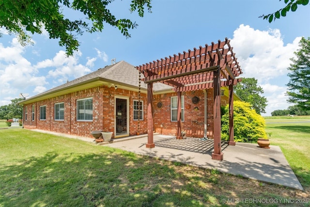 1701 N Skinner Ave, Drumright, OK 74030 - back of property featuring a pergola, a patio, a lawn, brick siding, and a tile roof