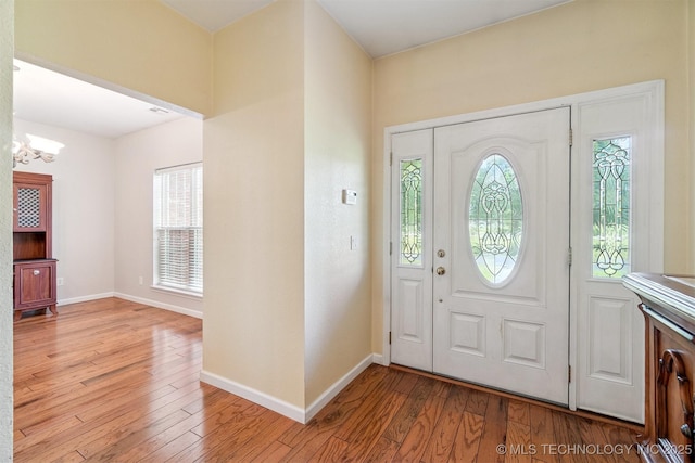 1701 N Skinner Ave, Drumright, OK 74030 - entrance foyer with a chandelier and light wood finished floors