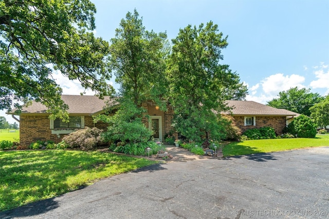1605 N Skinner Ave, Drumright, OK 74030 - view of front of house featuring a front lawn and brick siding