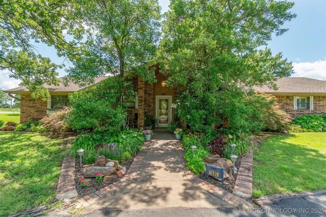 1605 N Skinner Ave, Drumright, OK 74030 - view of front of house featuring a front yard and brick siding