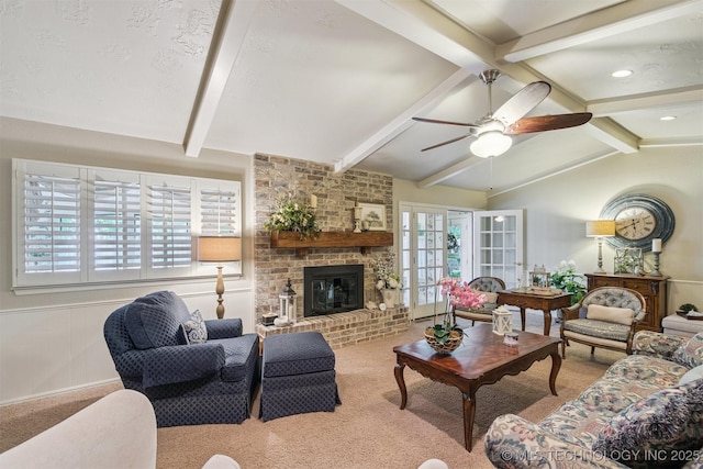 1605 N Skinner Ave, Drumright, OK 74030 - carpeted living area featuring ceiling fan and a brick fireplace