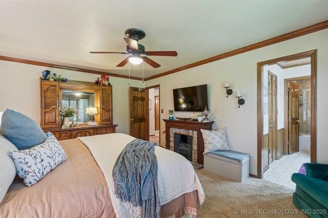 1605 N Skinner Ave, Drumright, OK 74030 - bedroom with a fireplace, crown molding, light colored carpet, a ceiling fan, and ensuite bath