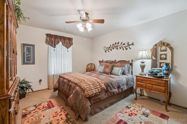 1605 N Skinner Ave, Drumright, OK 74030 - bedroom with light colored carpet and ceiling fan