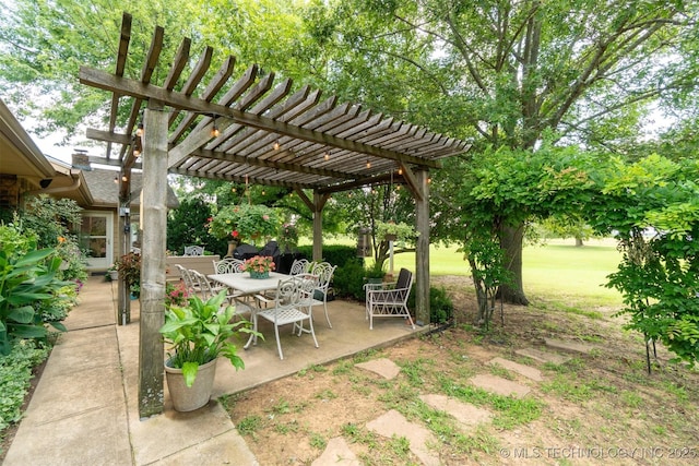 1605 N Skinner Ave, Drumright, OK 74030 - view of yard featuring a patio area, a pergola, and outdoor dining area