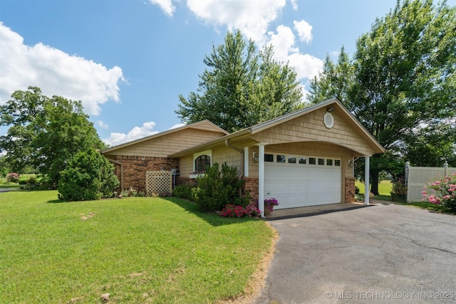 1605 N Skinner Ave, Drumright, OK 74030 - ranch-style house featuring driveway, an attached garage, and brick siding