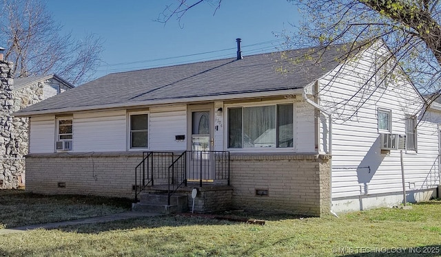 1504 E 51st St, Tulsa, OK 74126 - bungalow-style house with a front lawn, a shingled roof, brick siding, crawl space, and cooling unit