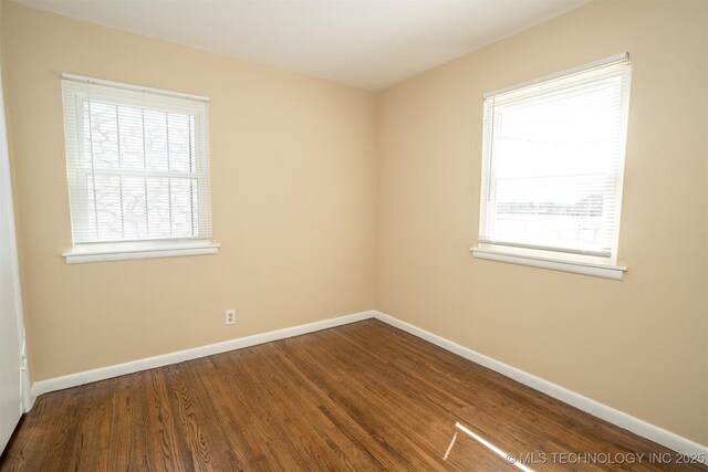 1504 E 51st St, Tulsa, OK 74126 - empty room with wood finished floors and baseboards