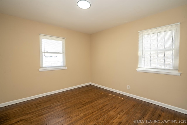 1504 E 51st St, Tulsa, OK 74126 - unfurnished room with baseboards and dark wood finished floors