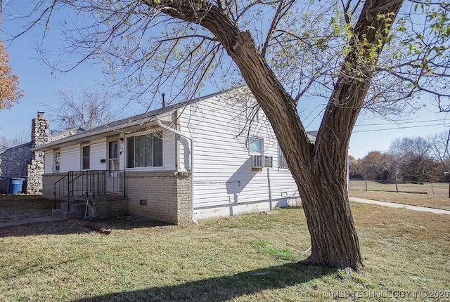 1504 E 51st St, Tulsa, OK 74126 - view of front facade featuring a front lawn, a chimney, and brick siding
