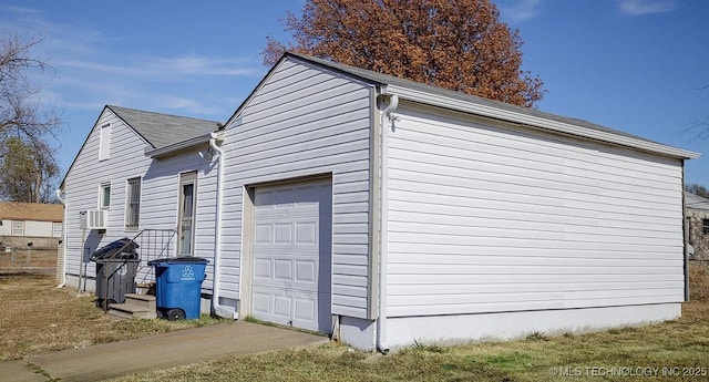1504 E 51st St, Tulsa, OK 74126 - view of property exterior with a garage and cooling unit