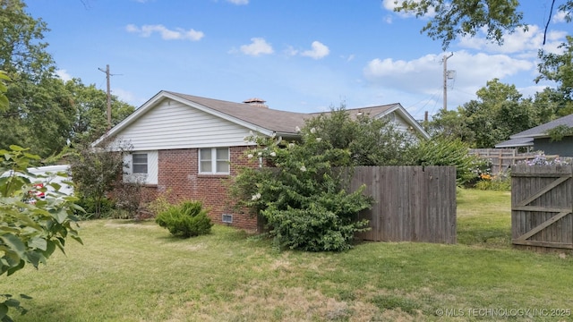 5105 E 30th Pl, Tulsa, OK 74114 - view of side of property featuring brick siding and crawl space