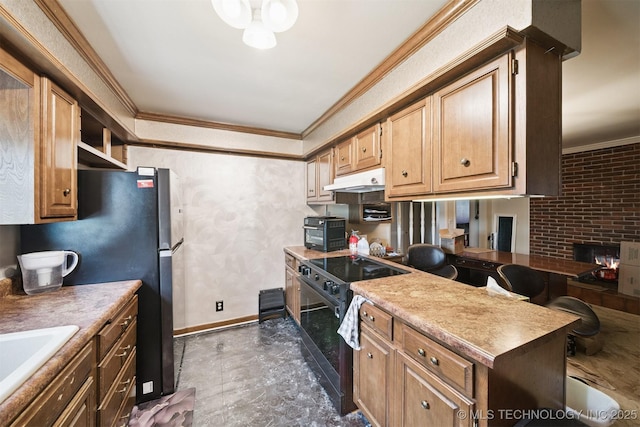 5105 E 30th Pl, Tulsa, OK 74114 - kitchen with black range with electric stovetop, ornamental molding, under cabinet range hood, freestanding refrigerator, and open shelves