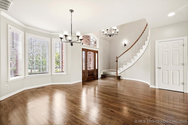 4207 S 69th W Ave, Tulsa, OK 74107 - entryway with a chandelier, wood finished floors, stairway, and ornamental molding