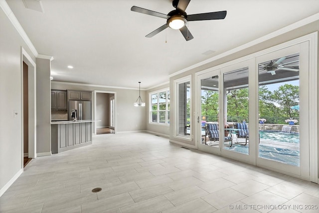 4207 S 69th W Ave, Tulsa, OK 74107 - unfurnished living room with a ceiling fan and ornamental molding