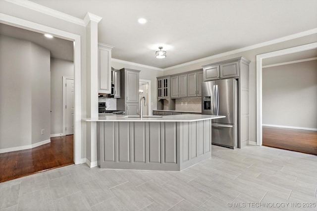 4207 S 69th W Ave, Tulsa, OK 74107 - kitchen featuring stainless steel refrigerator with ice dispenser, gray cabinetry, range, a peninsula, and light countertops