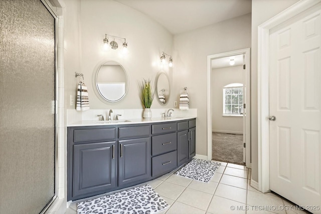 4207 S 69th W Ave, Tulsa, OK 74107 - bathroom with double vanity, tile patterned flooring, and a shower with shower door