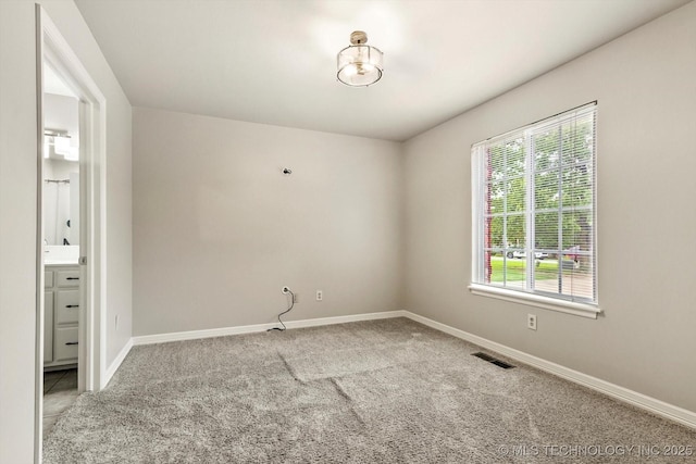 4207 S 69th W Ave, Tulsa, OK 74107 - carpeted spare room featuring baseboards