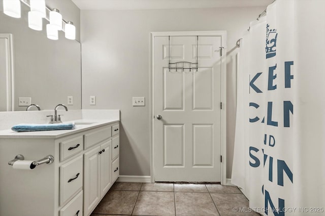 4207 S 69th W Ave, Tulsa, OK 74107 - full bathroom featuring vanity, tile patterned flooring, and a shower with shower curtain