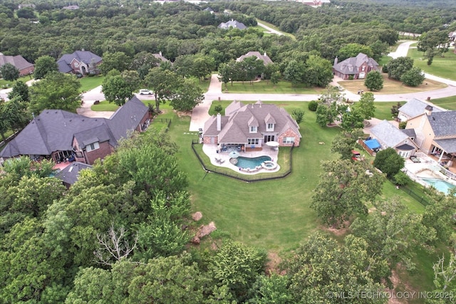 4207 S 69th W Ave, Tulsa, OK 74107 - aerial perspective of suburban area featuring a pool and a heavily wooded area