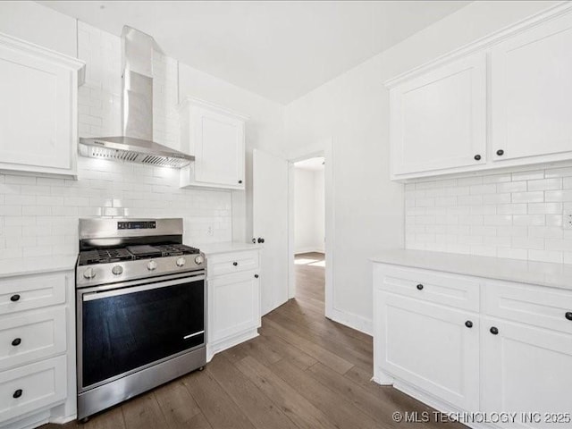 402 E Patti Page Blvd, Claremore, OK 74017 - kitchen with stainless steel range with gas cooktop, wall chimney exhaust hood, light countertops, and white cabinets