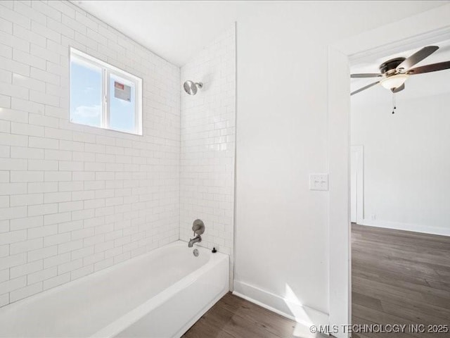 402 E Patti Page Blvd, Claremore, OK 74017 - full bathroom with wood finished floors, washtub / shower combination, and ceiling fan