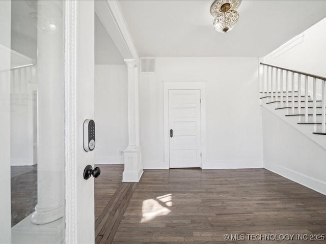 402 E Patti Page Blvd, Claremore, OK 74017 - foyer with decorative columns, wood finished floors, and stairs