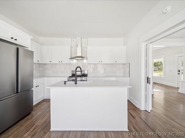 402 E Patti Page Blvd, Claremore, OK 74017 - kitchen with stainless steel appliances, wall chimney range hood, light countertops, and decorative backsplash