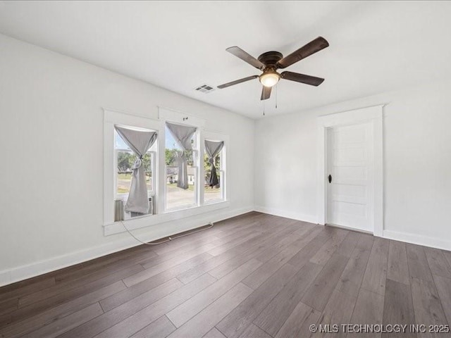 402 E Patti Page Blvd, Claremore, OK 74017 - spare room featuring a ceiling fan and wood finished floors