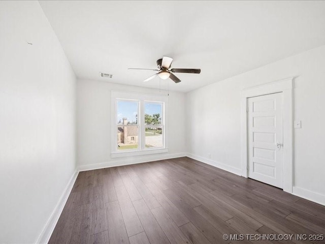 402 E Patti Page Blvd, Claremore, OK 74017 - unfurnished room featuring ceiling fan and dark wood-style floors
