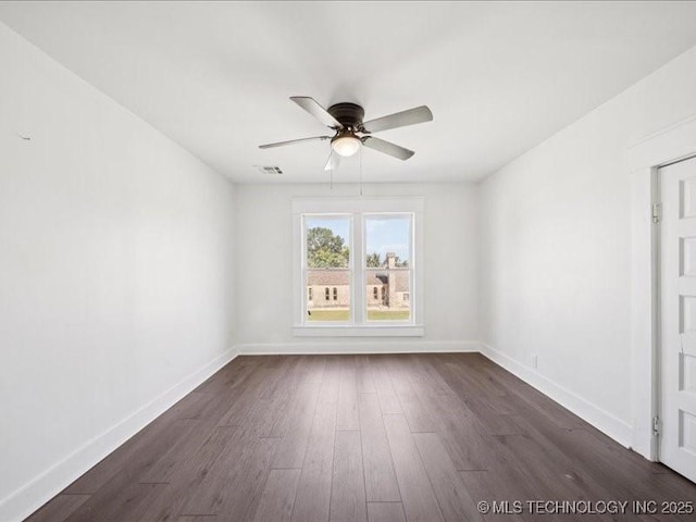 402 E Patti Page Blvd, Claremore, OK 74017 - unfurnished room with ceiling fan and dark wood-style floors