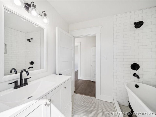 402 E Patti Page Blvd, Claremore, OK 74017 - bathroom featuring a freestanding bath, vanity, a tile shower, and tile patterned floors