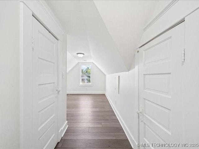 402 E Patti Page Blvd, Claremore, OK 74017 - bonus room featuring dark wood-type flooring and vaulted ceiling