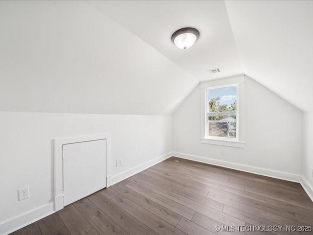 402 E Patti Page Blvd, Claremore, OK 74017 - bonus room with dark wood finished floors and lofted ceiling