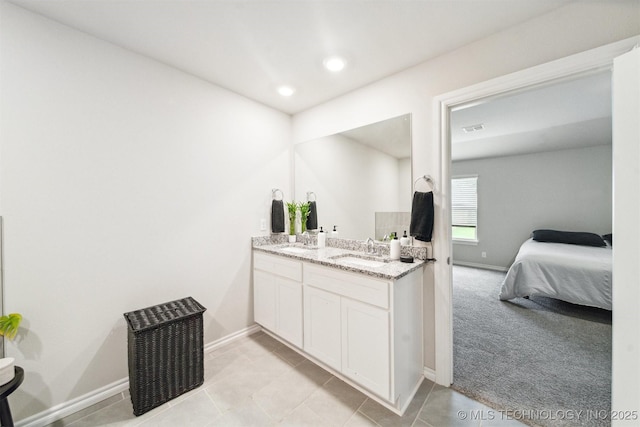7117 E 154th Pl S, Bixby, OK 74008 - ensuite bathroom featuring double vanity, tile patterned floors, and recessed lighting