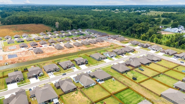 7117 E 154th Pl S, Bixby, OK 74008 - aerial perspective of suburban area with a forest
