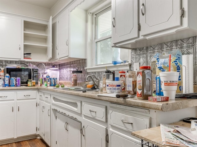6330 Norman Ave, Oklahoma City, OK 73122 - kitchen featuring open shelves, white cabinetry, and light countertops