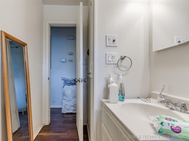 6330 Norman Ave, Oklahoma City, OK 73122 - bathroom featuring wood finished floors and vanity