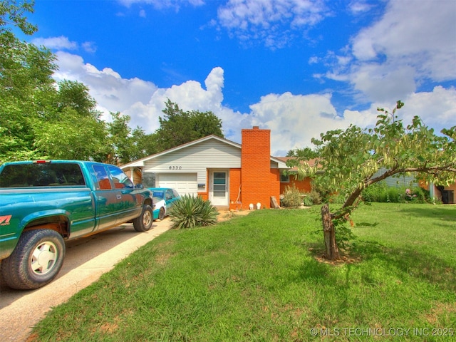 6330 Norman Ave, Oklahoma City, OK 73122 - view of front of property featuring driveway, a chimney, an attached garage, and a front yard
