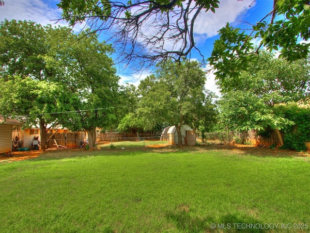 6330 Norman Ave, Oklahoma City, OK 73122 - fenced backyard featuring a storage shed