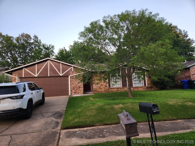 1669 S Pine Ave W, Broken Arrow, OK 74012 - view of front of house featuring a front lawn, a garage, driveway, and brick siding