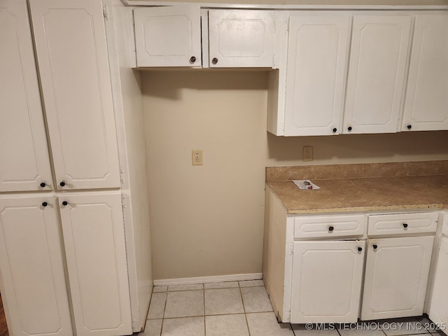 1669 S Pine Ave W, Broken Arrow, OK 74012 - kitchen featuring white cabinetry and light tile patterned floors