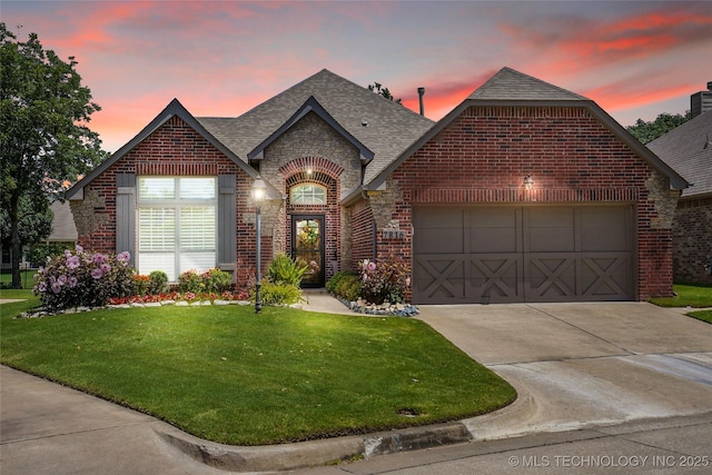 7816 E Galveston St, Broken Arrow, OK 74014 - french country style house featuring brick siding, a shingled roof, driveway, and an attached garage