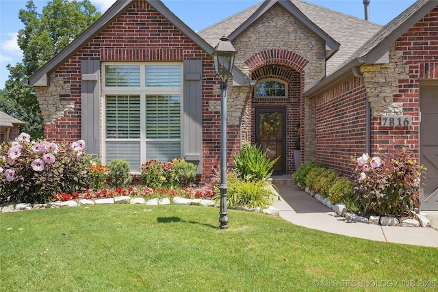 7816 E Galveston St, Broken Arrow, OK 74014 - view of front of home featuring brick siding, a front lawn, and roof with shingles