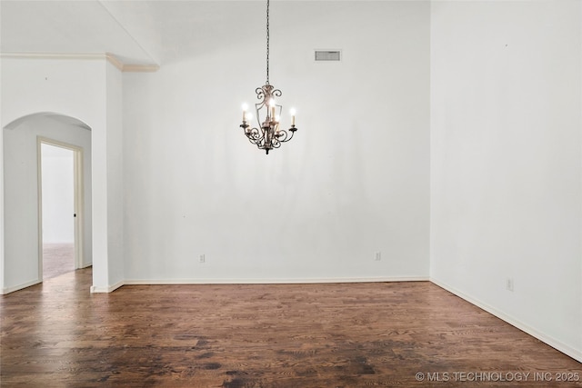 7816 E Galveston St, Broken Arrow, OK 74014 - spare room with arched walkways, a chandelier, wood finished floors, and ornamental molding